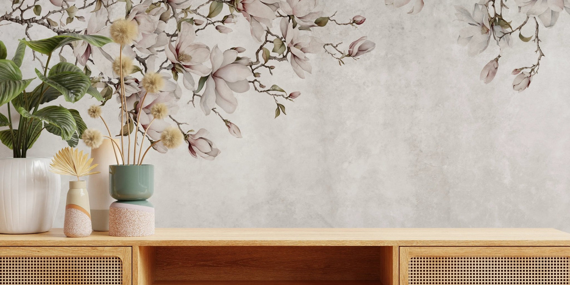 Wooden sideboard with potted plants in front of a blossoms wall mural.
