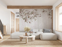 Large white sectional sofa against a grey ethereal floral pattern wall mural.