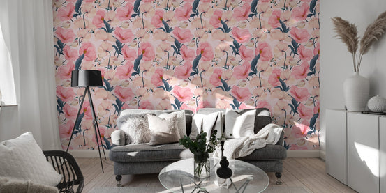 Pink flower wallpaper behind a grey sofa in a modern living area.