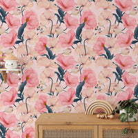 Eustoma pink floral watercolor wallpaper behind a wooden console table with plants.