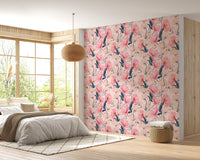 Floral watercolor wallpaper on a bedroom wall featuring a wicker pendant light.