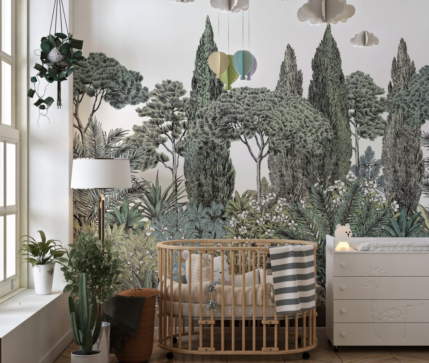 Tropical jungle mural with rich leafy details in a nursery.