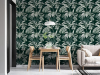 Exotic Jungle Tropical Green Leaves Repeat Wallpaper in a dining room with oak chairs.