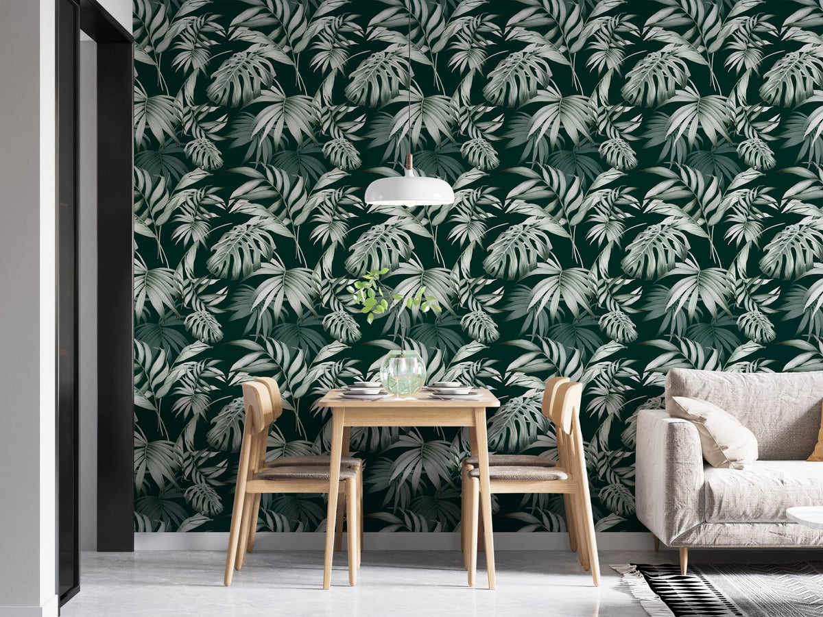 Exotic Jungle Tropical Green Leaves Repeat Wallpaper in a dining room with oak chairs.