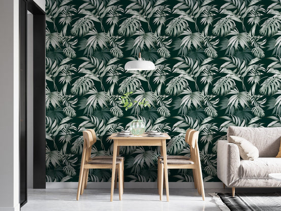 Exotic Jungle Tropical Green Leaves Repeat Wallpaper in a dining room with oak chairs.