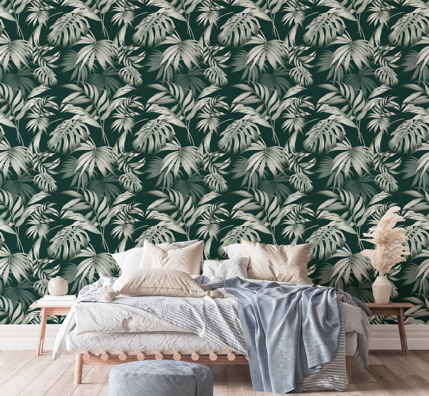 Exotic Jungle Tropical Green Leaves Repeat Wallpaper in a bedroom with a wooden bed.
