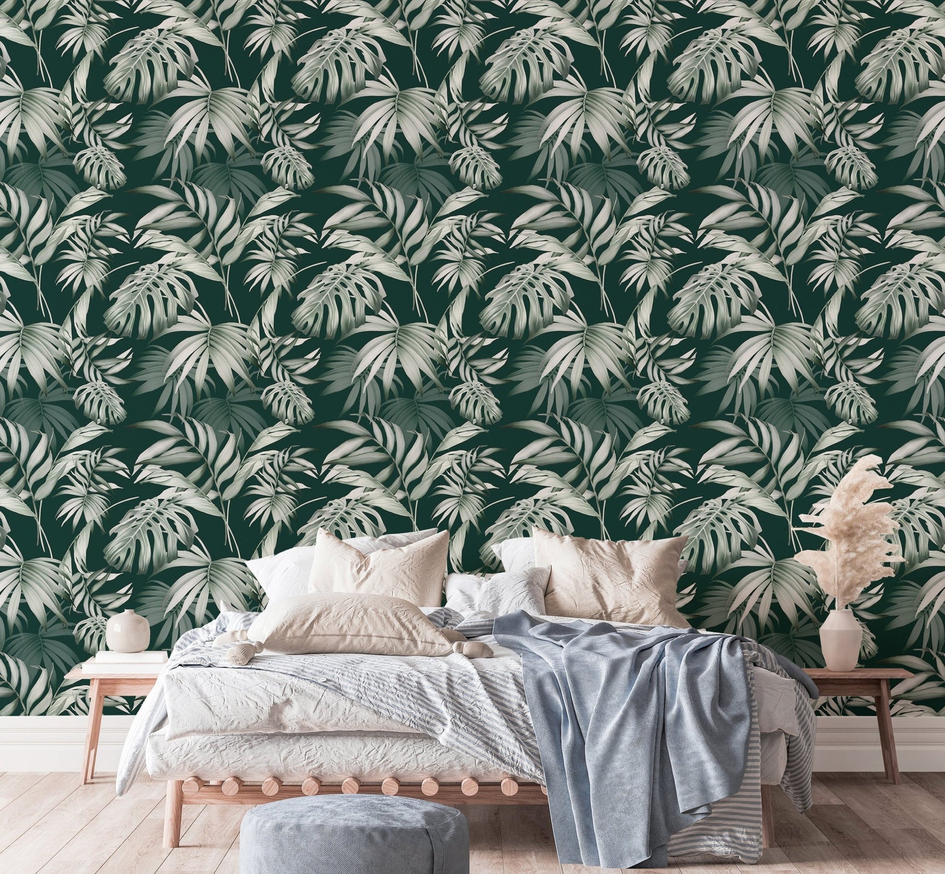 Exotic Jungle Tropical Green Leaves Repeat Wallpaper in a bedroom with a wooden bed.