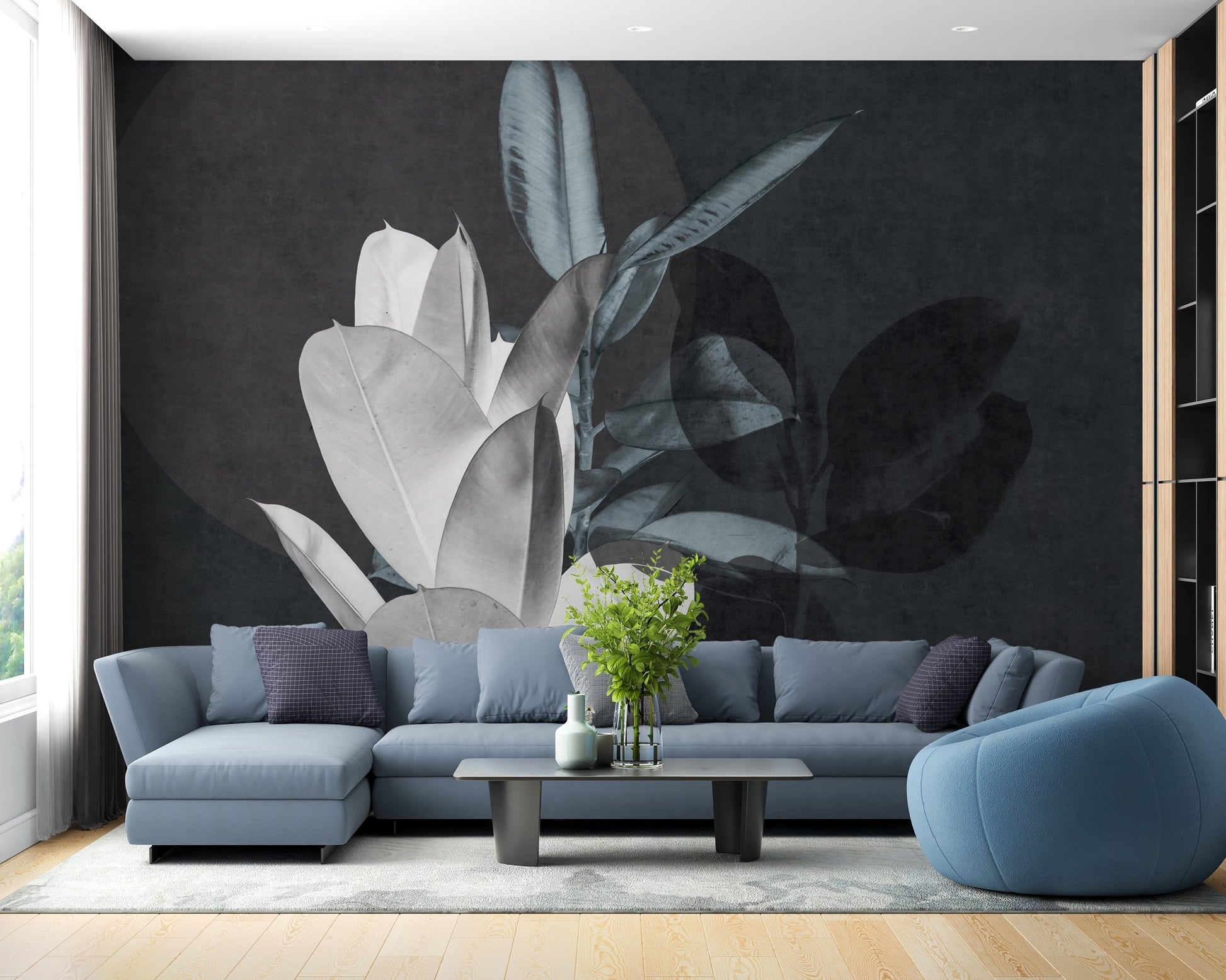Blue sectional sofa in front of charcoal leaf texture wall mural.