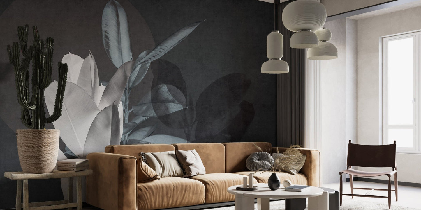 Tan sofa in a living area with dark leaf texture wall mural.