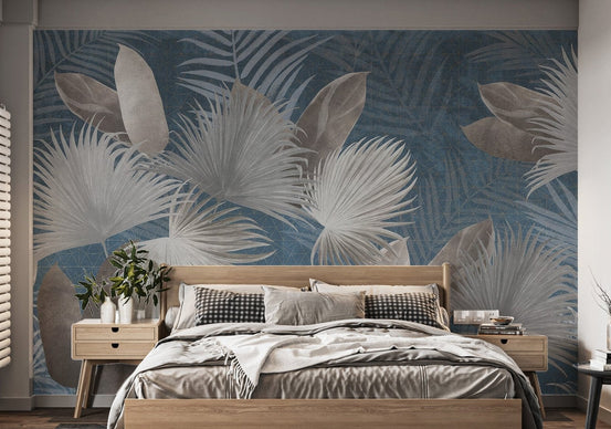 Exotic leaves wallpaper mural in blue and beige tropical style.
