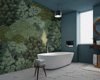 Tropical wall mural showing dark green and sage tree layers in bathroom.