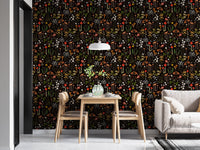 Modern dining space with a dark botanical flower wallpaper and wooden chairs.