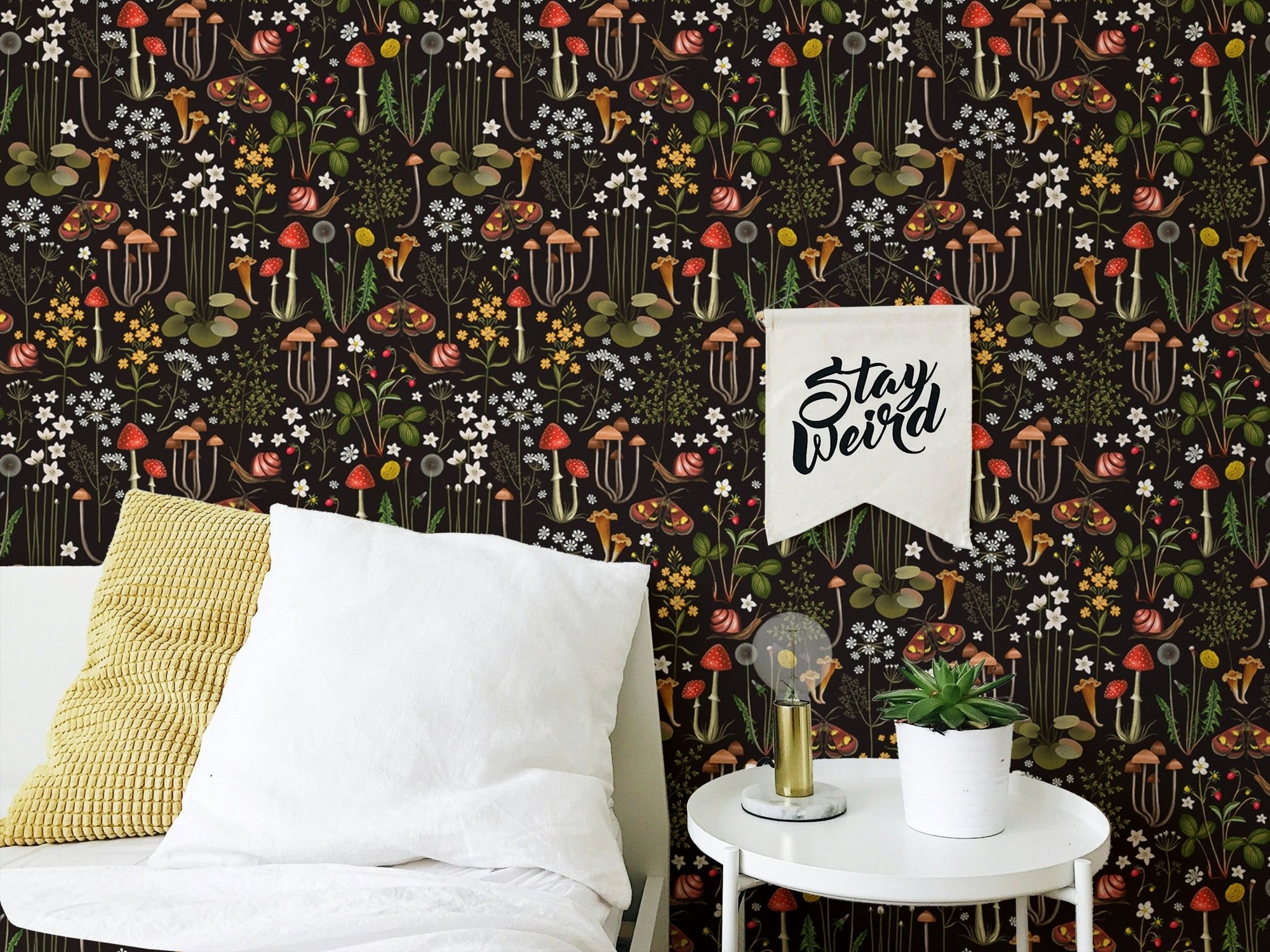 Fairy Forest Flower Mushrooms Black Background Wallpaper on a bedroom wall with pillows.