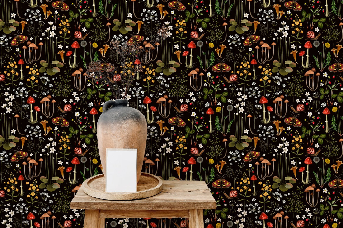 mushroom pattern wallpaper on a small wooden table with a white ceramic vase.