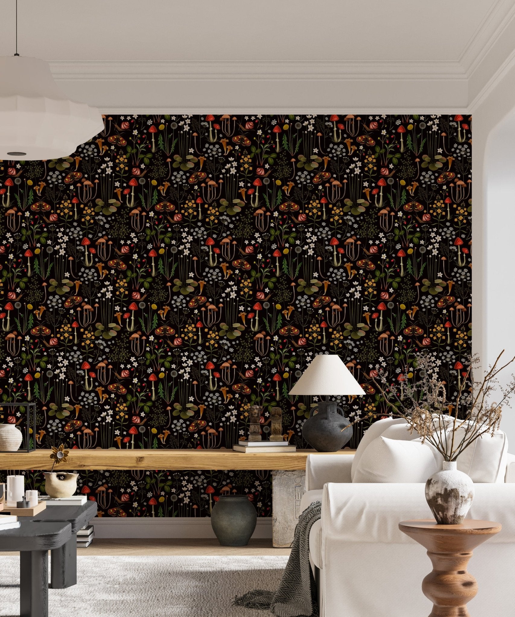 Dark flower wallpaper behind a wooden bench and white sofa in a living area.