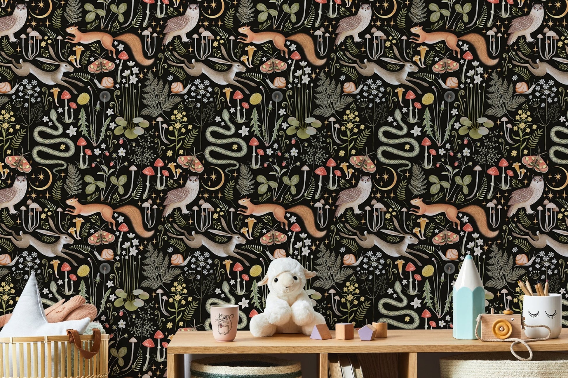 Forest creature wallpaper in a playroom with white toys and shelves.