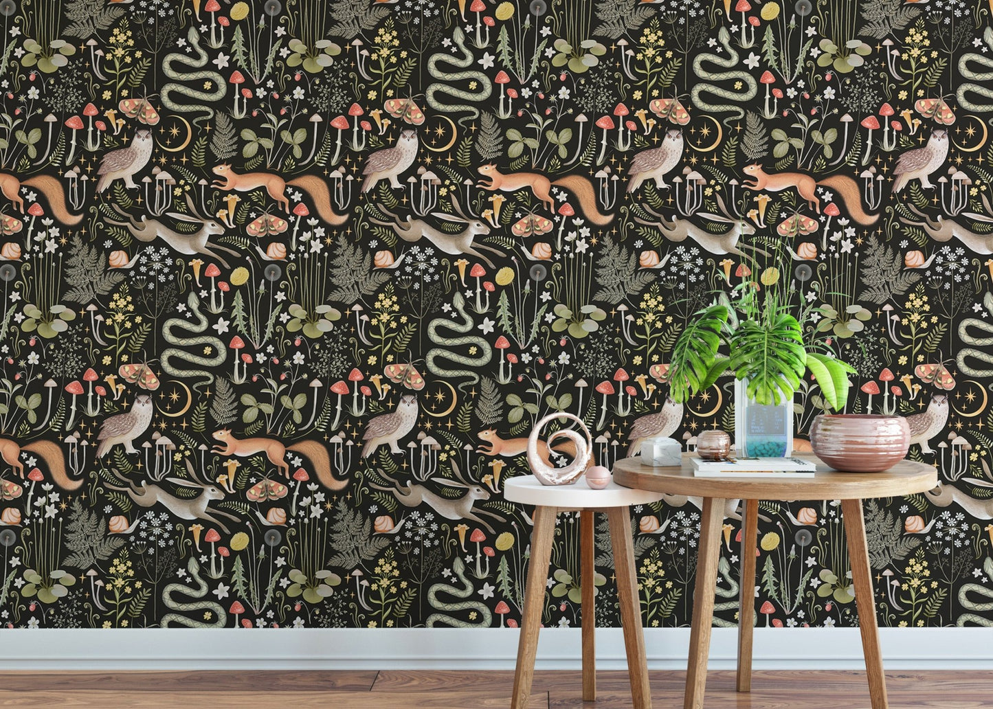 Dark woodland animal wallpaper pattern used in a bright living area.