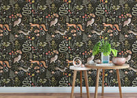 Dark woodland animal wallpaper pattern used in a bright living area.