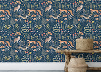 Fairy forest wallpaper with fox and owl on dark blue background in rustic room.