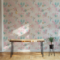 Pink themed unicorn wallpaper in a sunlit room with light wood flooring.