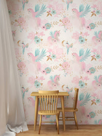 Unicorn wallpaper behind a small wooden table and chair set for children room.
