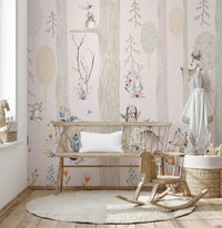 Neutral tone forest wall mural behind a wooden bench and rocking horse.