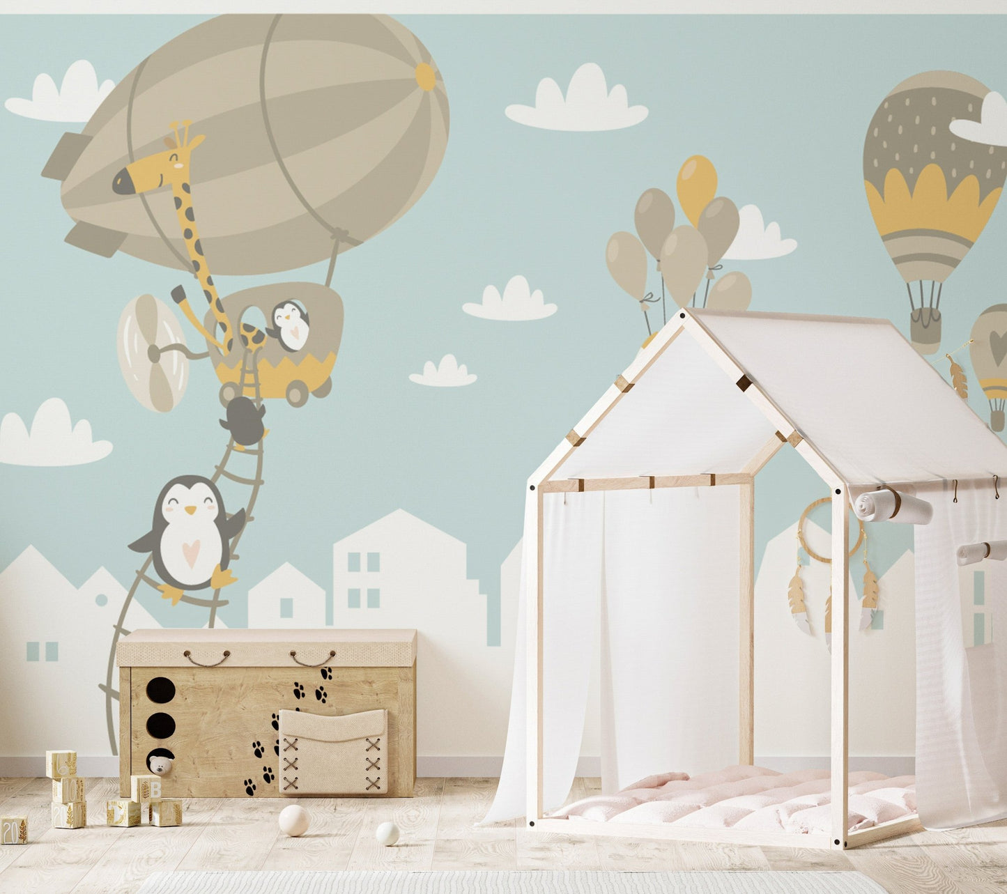 Whimsical fox and penguin balloon mural decor
