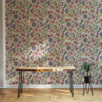 Minimalist wooden desk against a full wallpaper of vintage fantasy flowers.