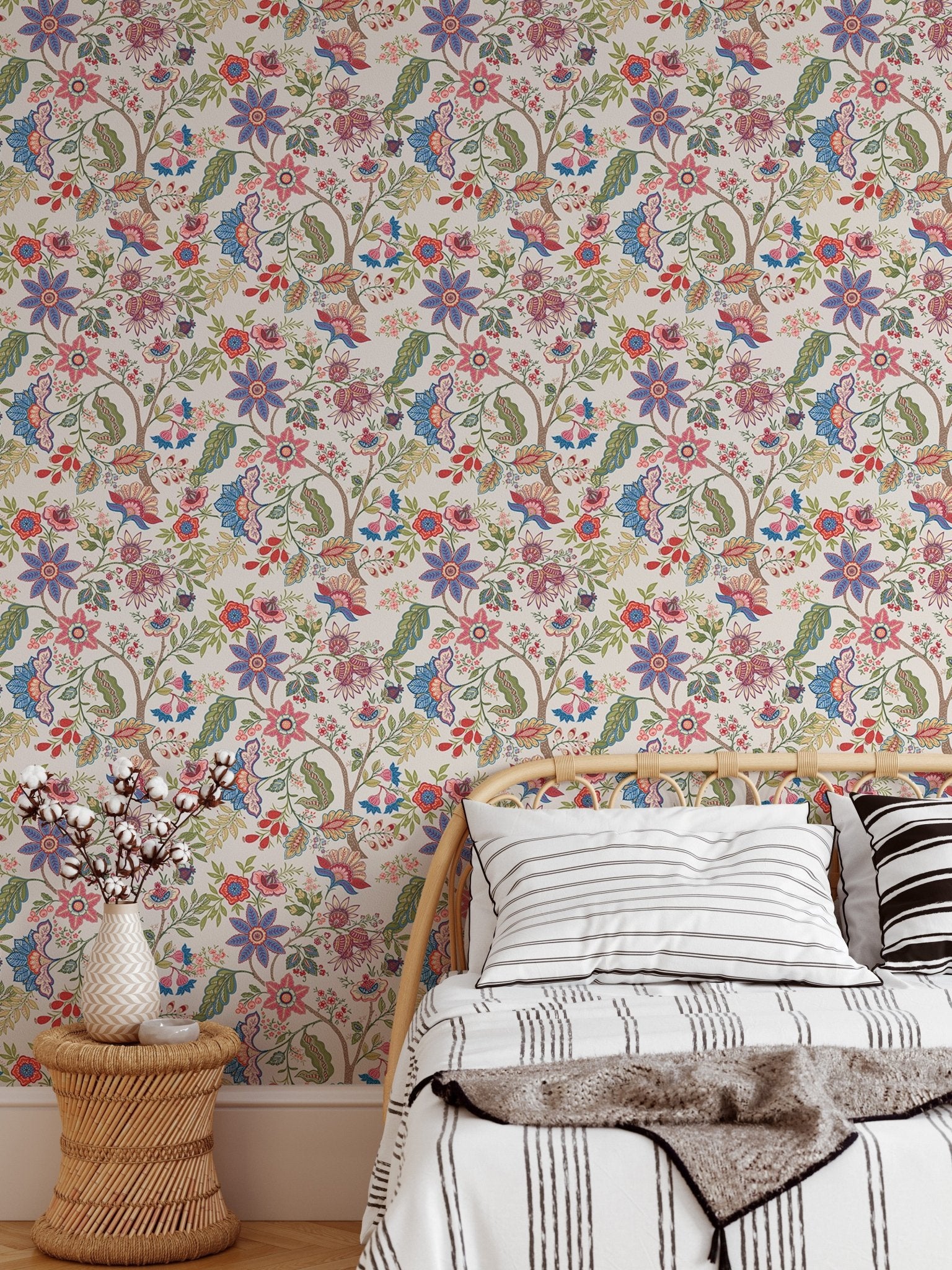 Daybed with white pillows against fantasy flowers retro vintage jacobean wallpaper.