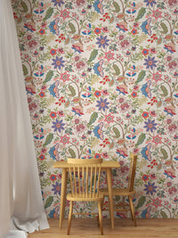 Small dining room with wooden table and chair set in front of a colorful flower  wallpaper.