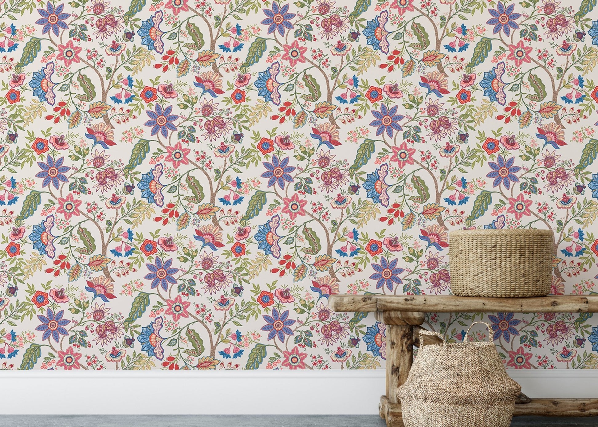 Rustic wooden bench placed in front of a multicolored floral pattern wallpaper.