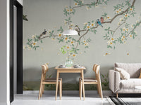 Floral canopy wall mural in a small dining area with light wood furniture.