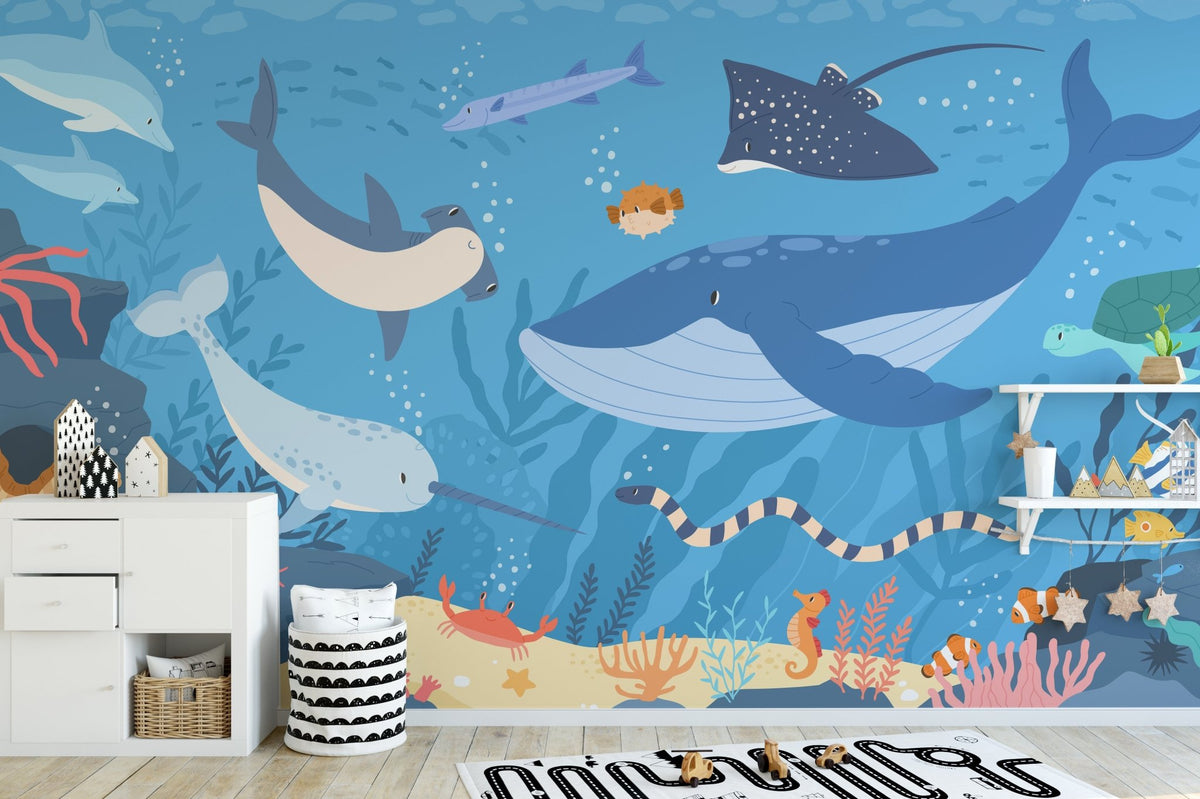 Sea life wall mural in a playroom featuring white storage cabinets.
