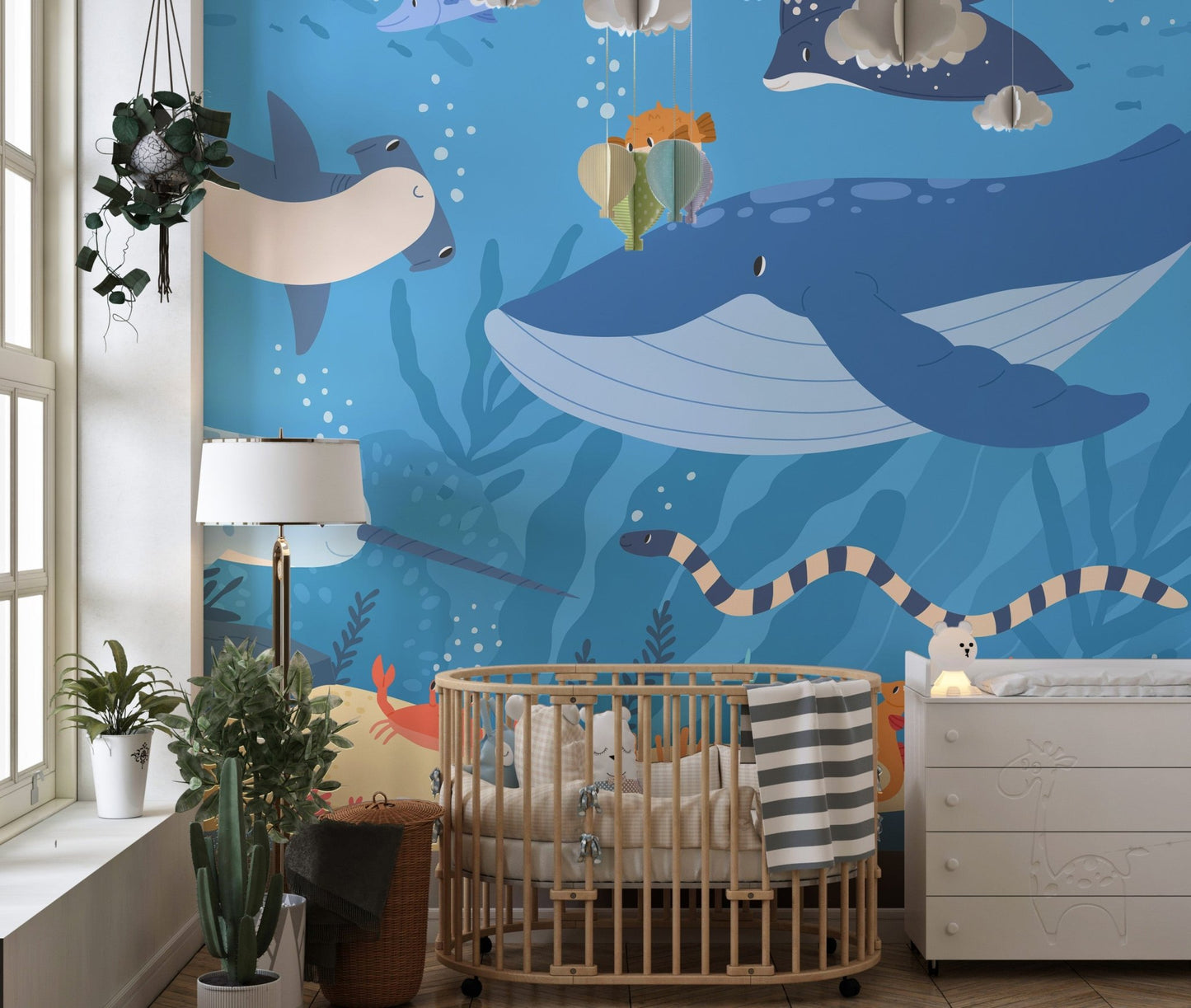 Underwater scene wall mural with a narwhal in a sunlit nursery.