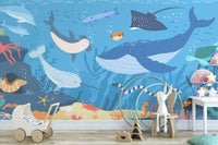 Fish and Marine Life Underwater wall mural in a child's room with toys.