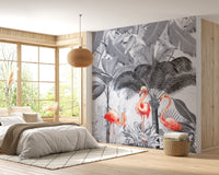 Large wall mural with gray palm leaves and flamingos in a bright, airy bedroom.