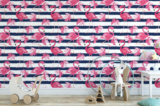 Pink flamingo wallpaper behind a white sideboard and indoor potted plants.
