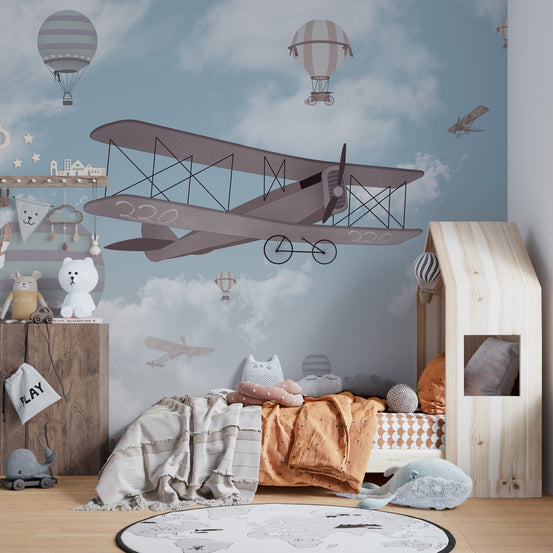 Vintage flight wall mural in a wooden themed kids bedroom.