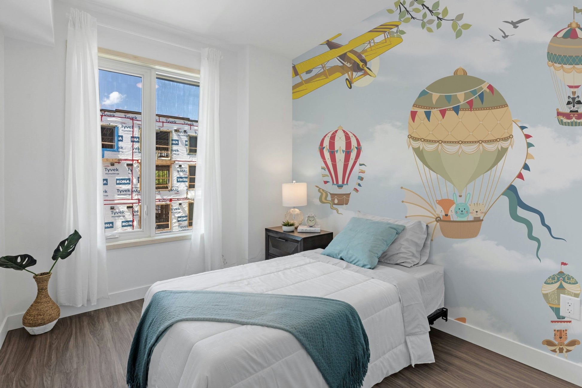 Small bedroom with vintage aviation and balloon wall mural