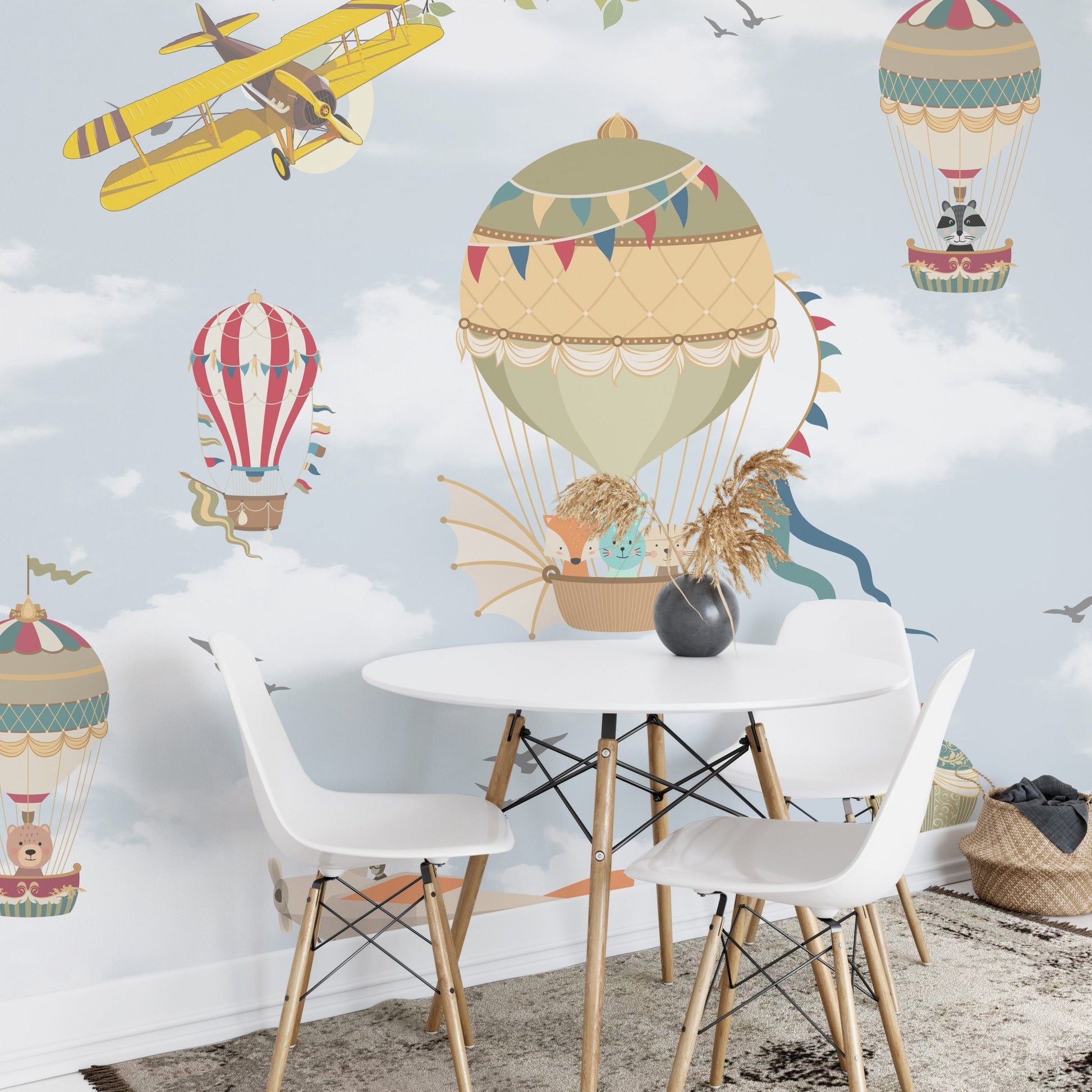 Light blue wall mural showing airplanes and balloons in a dining area.