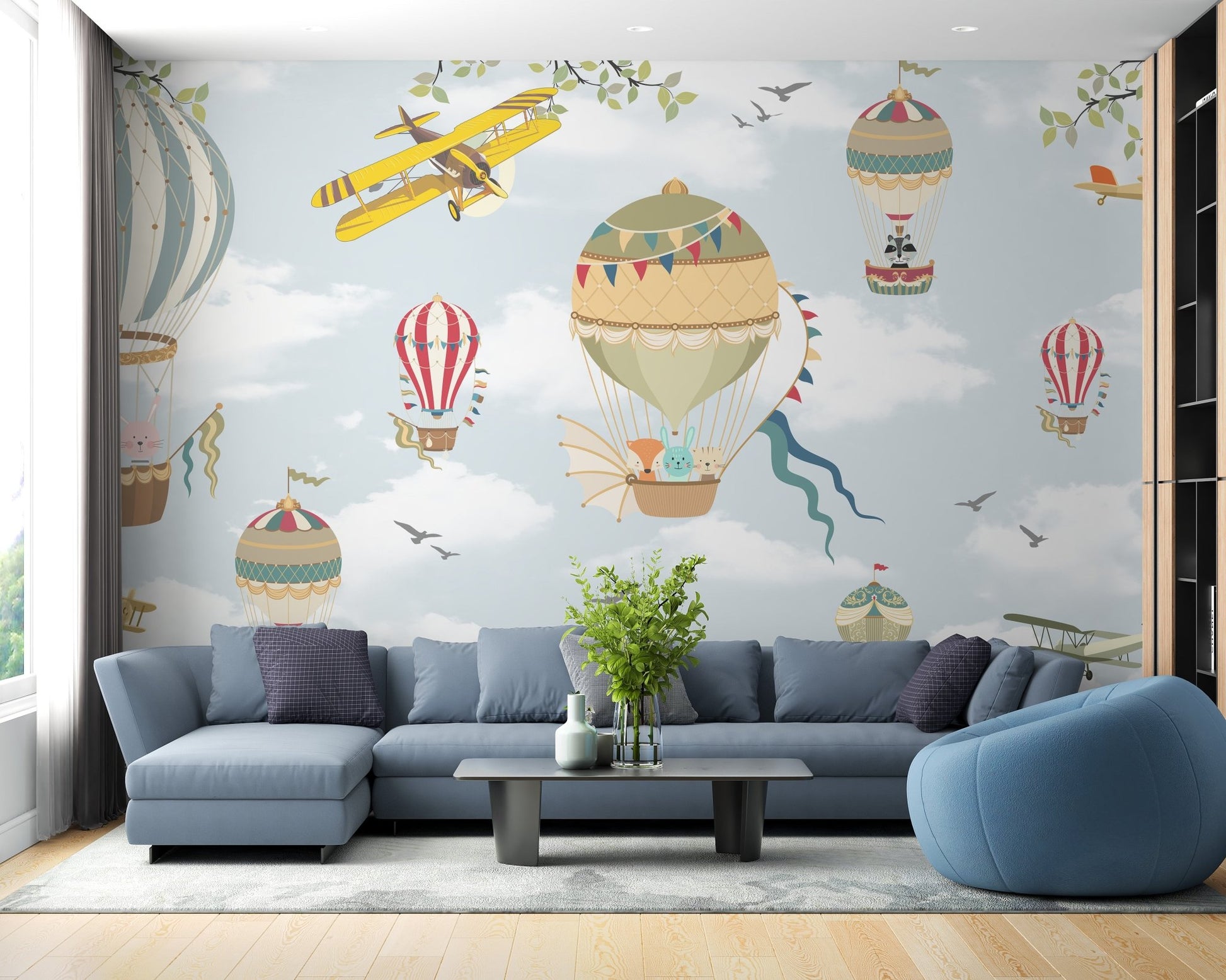Blue sky wall mural with vintage yellow planes and hot air balloon in living room.