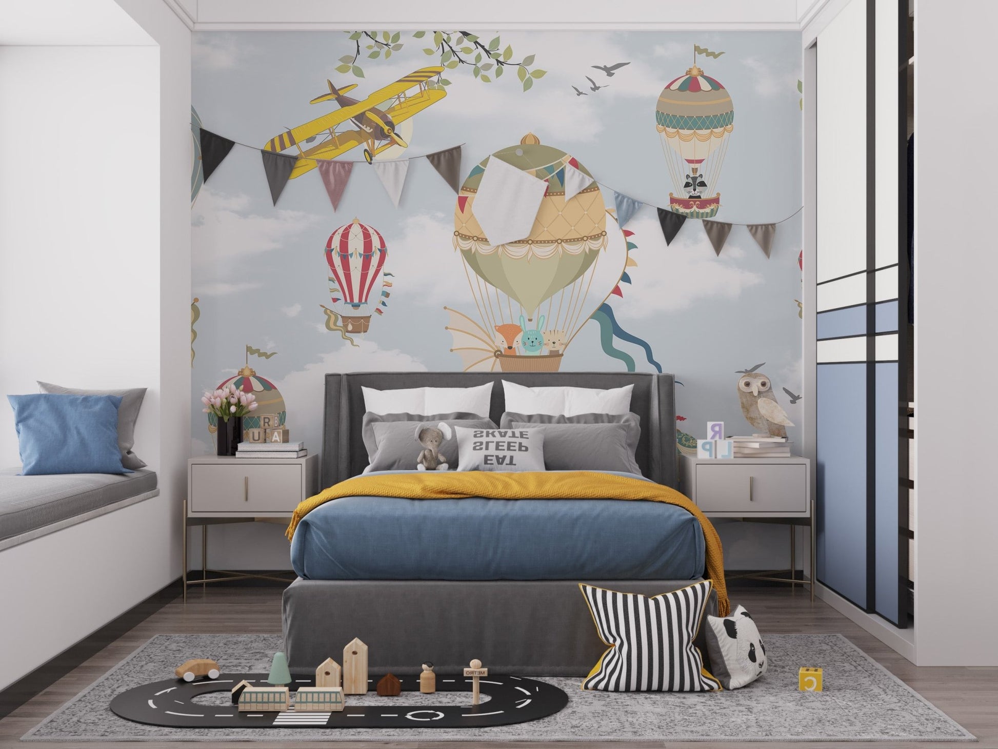 Kids bedroom wall mural featuring colorful hot air balloons and clouds.