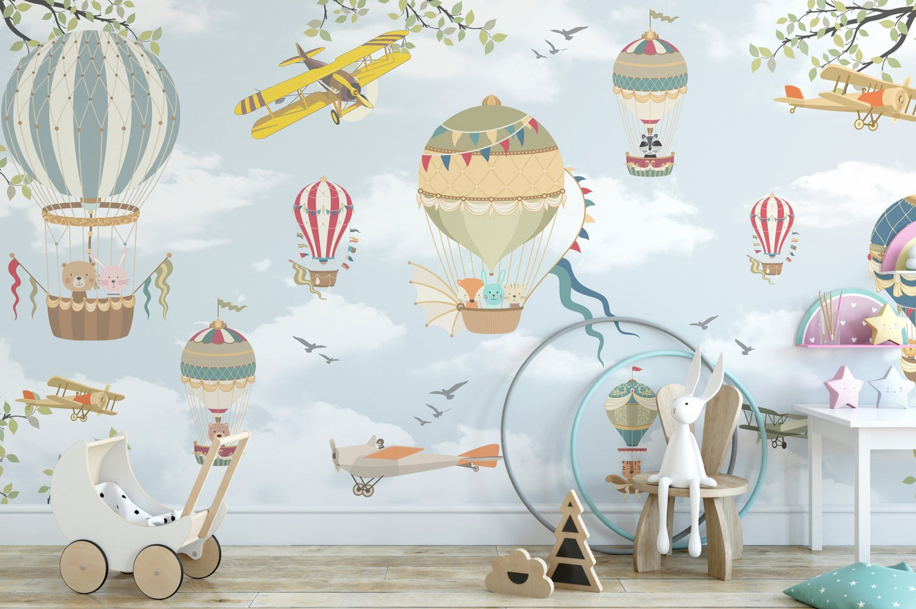 Playroom wall mural featuring blue skies, planes, and colorful balloons.