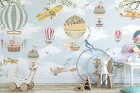 Playroom wall mural featuring blue skies, planes, and colorful balloons.