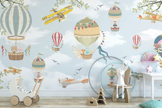 Playroom wall mural featuring blue skies, planes, and colorful balloons.
