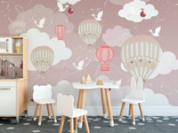 Dining area wall mural with floating balloons behind a small table and chairs set.