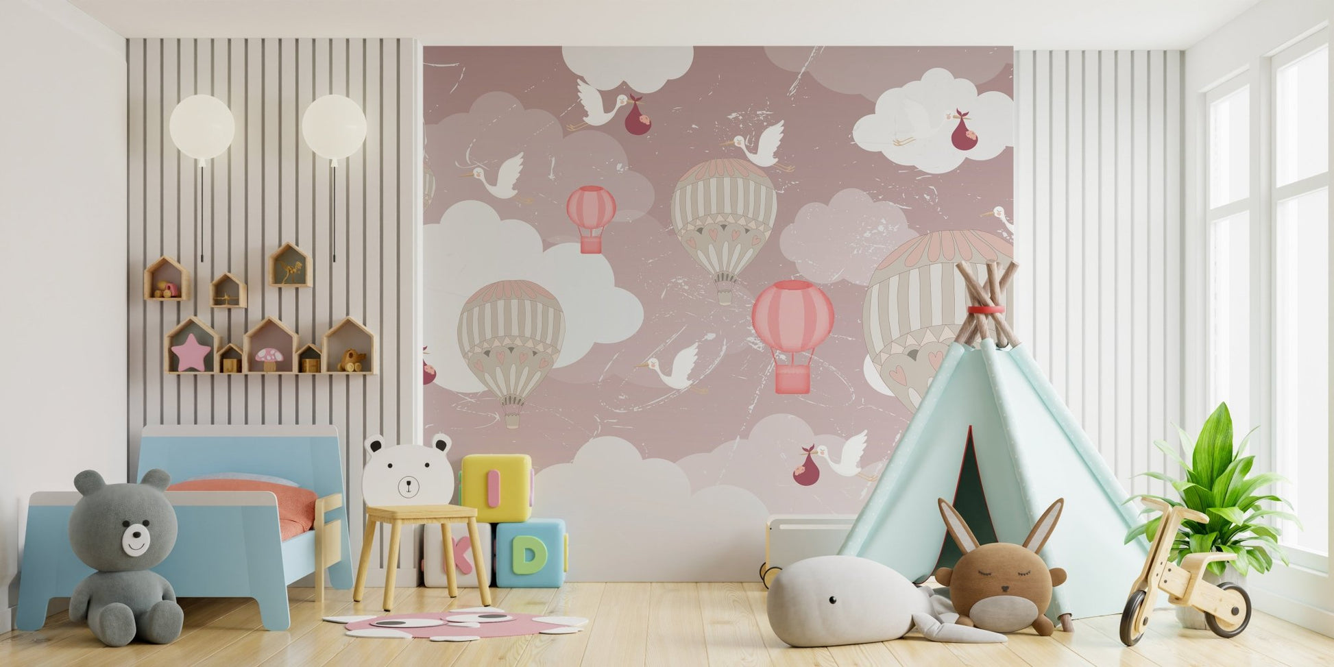 Pink and grey balloon wall mural in a playroom with a green teepee tent.