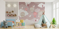 Pink and grey balloon wall mural in a playroom with a green teepee tent.
