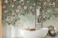 Hanging branch wall mural with blush pink flowers and soft green leaves.