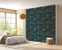 Floral dark blue background leaves removable wallpaper in a bright bedroom.